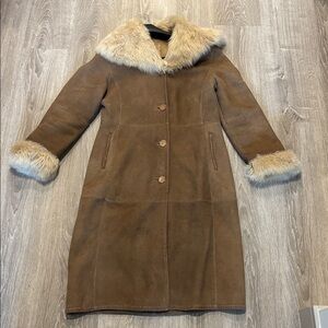 Tan shearling, high-quality tan coat with accentuated ivory fur. Price firm.